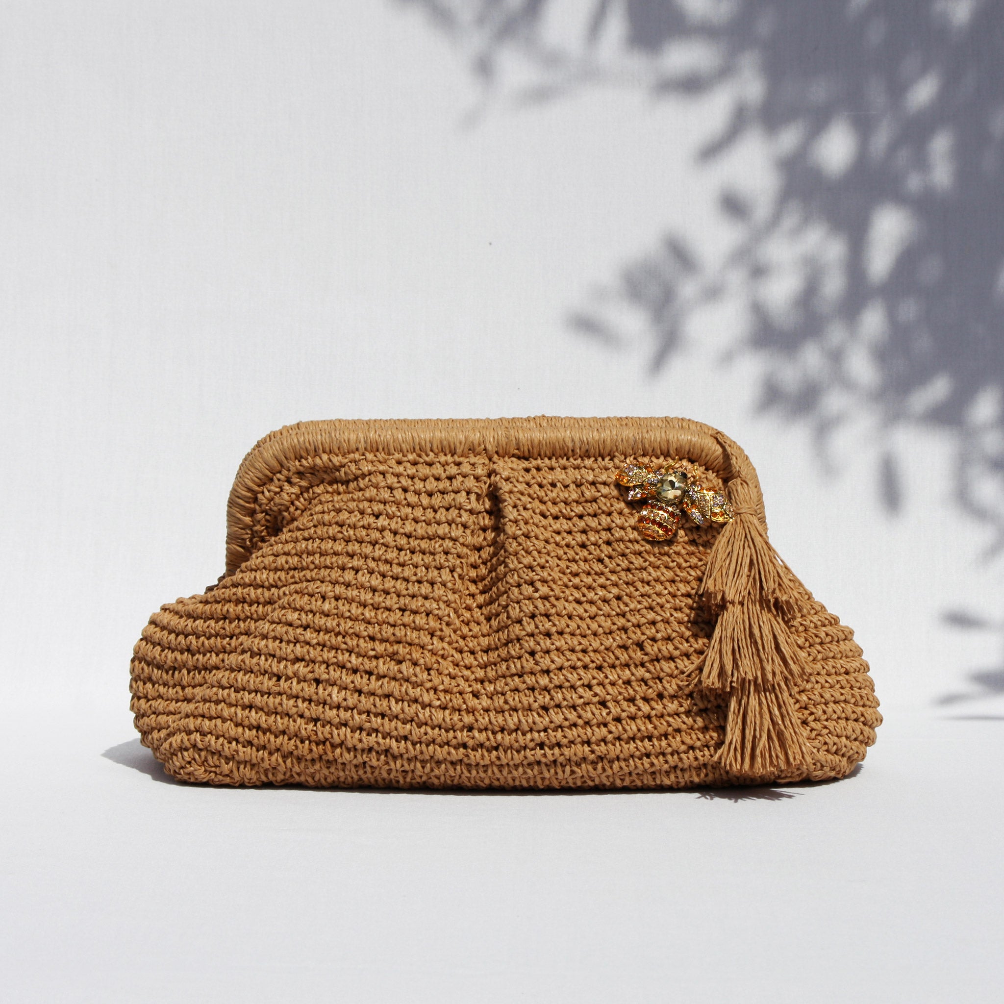 AMARA BEE CLUTCH BAG- SAND